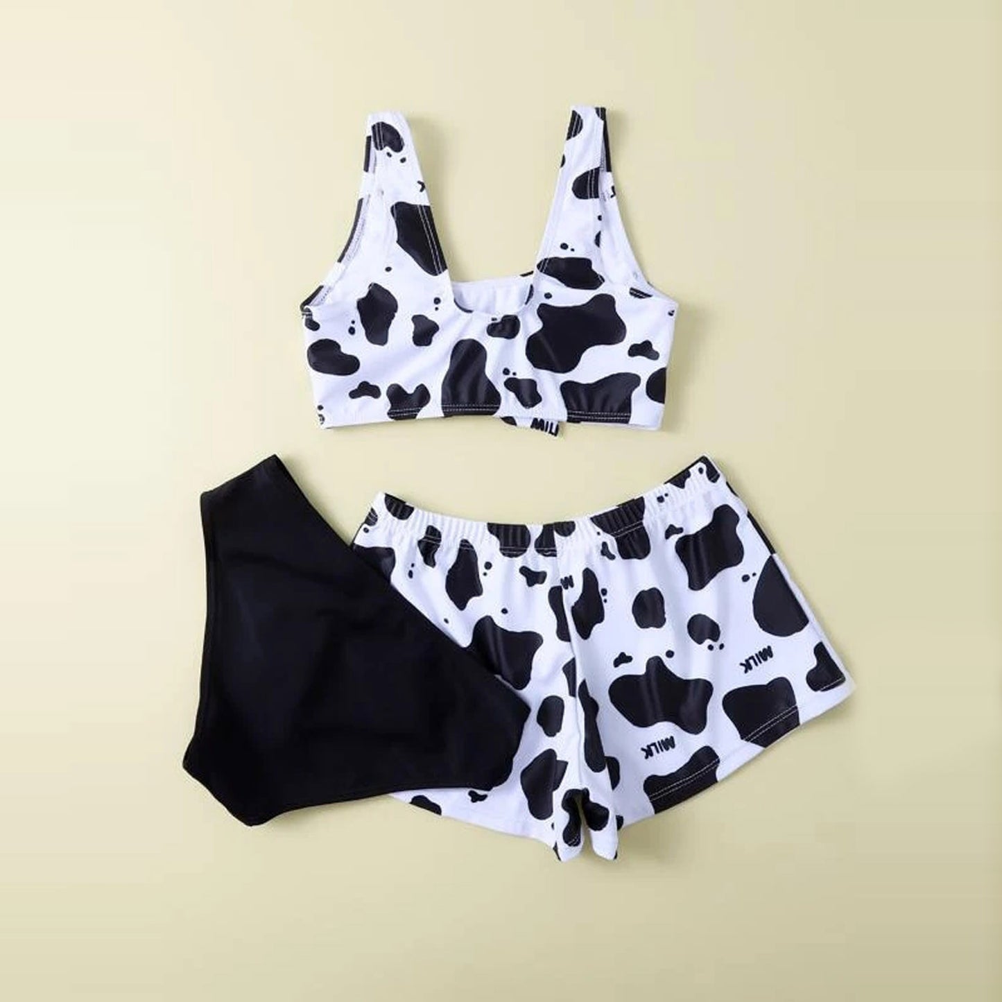 Playful cow-print split three-piece bikinis